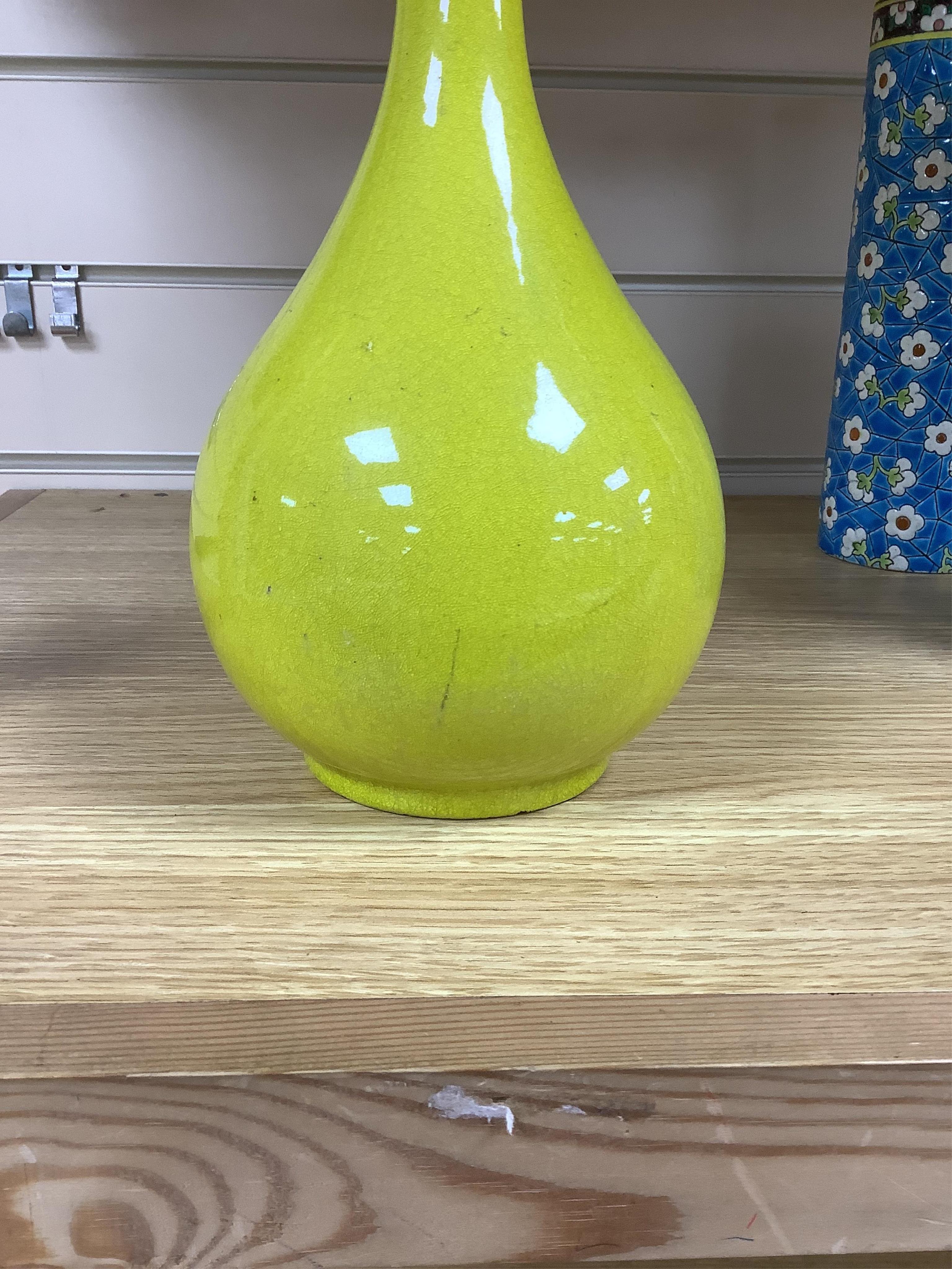 A Chinese or Japanese monochrome yellow bottle vase, 32cm high. Condition - crazed